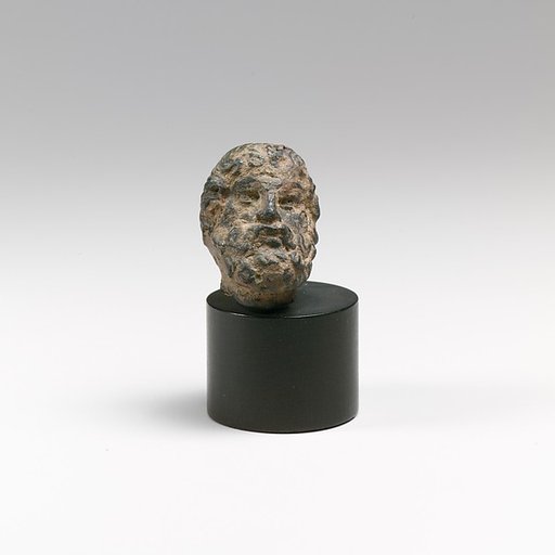 Bronze head of a bearded man or god