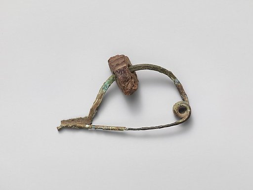 Bronze fibula (safety pin) with amber segment