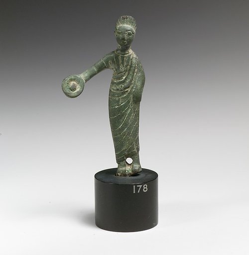 Statuette of a woman holding a phiale (libation vessel)