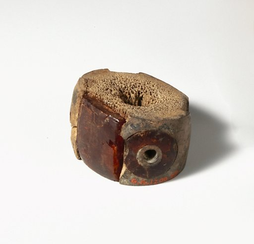 Bone and amber segment from a bronze fibula (safety pin)