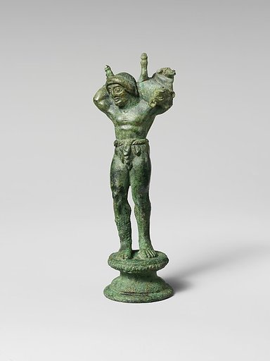 Bronze statuette of a youth carrying a pig