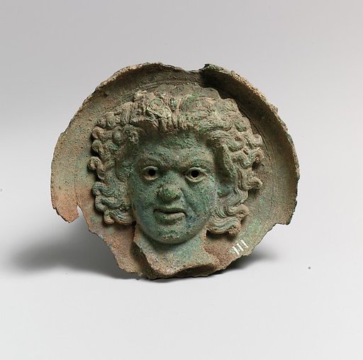 Silvered bronze roundel with satyr head (one of a pair)