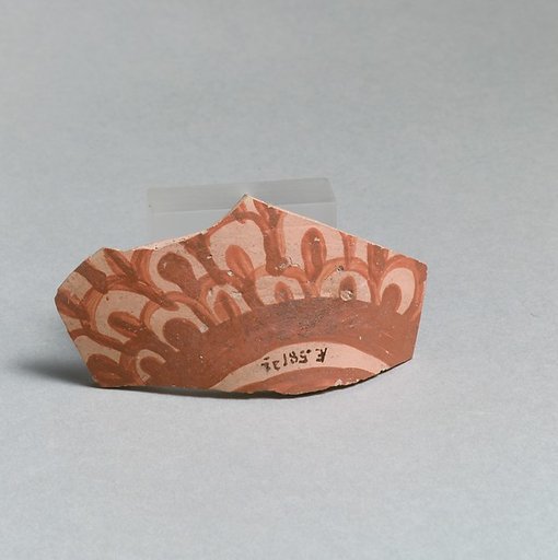 Terracotta vessel fragment with scale pattern