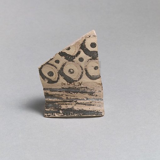 Terracotta rim from a vase with bands and dots in circles