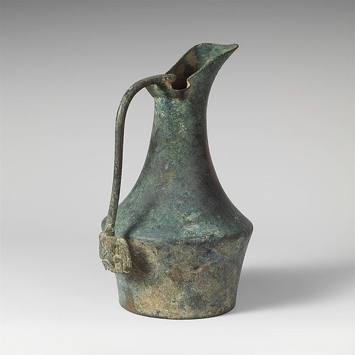 Bronze jug with handle attachment showing running youth