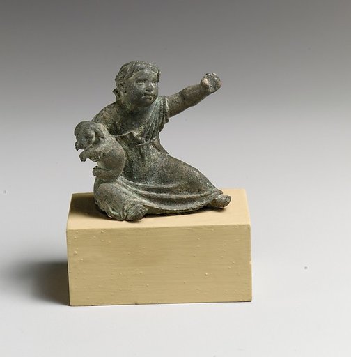 Bronze statuette of a girl holding a dog