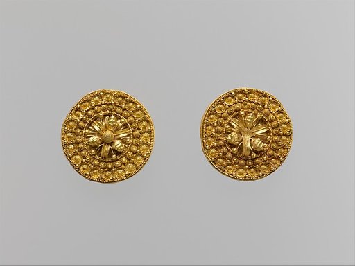 Gold disks with floral motifs and lions' heads