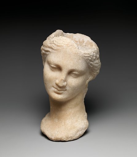 Marble head of a girl from a small statue