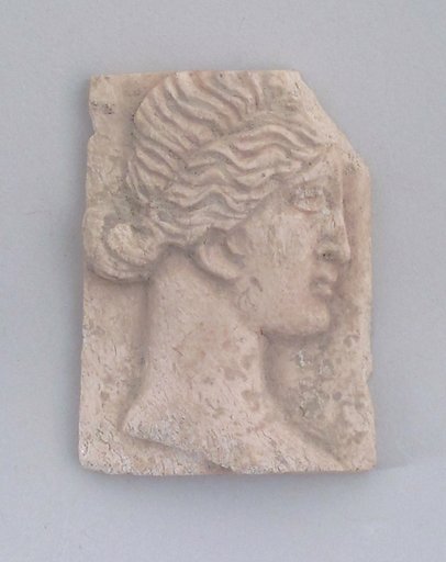 Relief of a head of woman