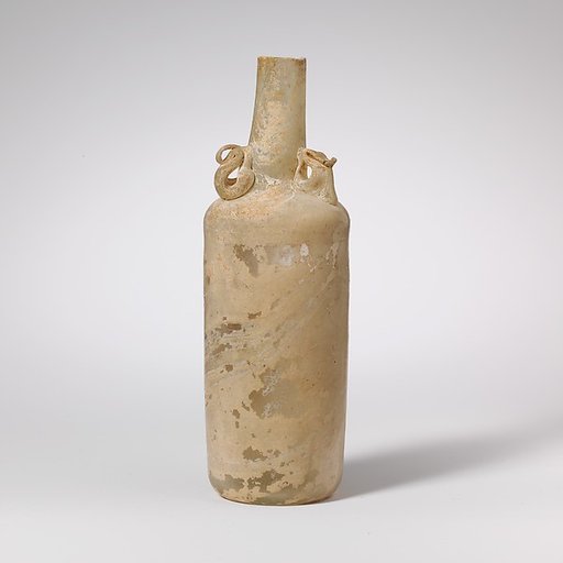 Glass bottle with dolphin handles