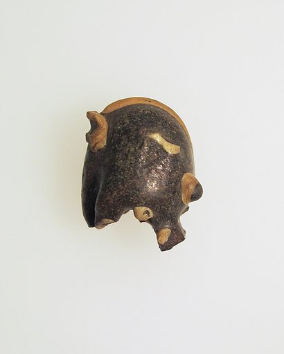 Glass pendant in the form of a demonic mask