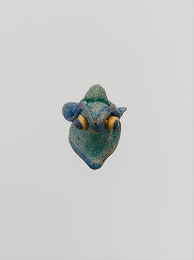 Glass pendant in the form of a demonic mask
