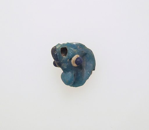 Glass pendant in the form of a demonic mask