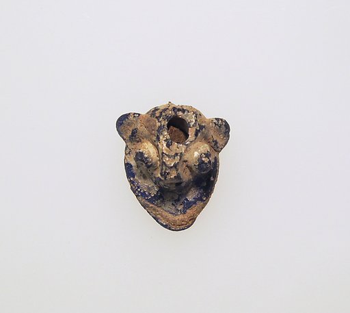 Glass pendant in the form of a demonic mask