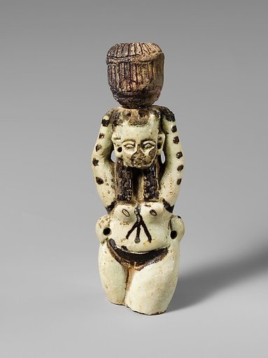 Fragment of a faience statuette of a woman holding a vase on her head
