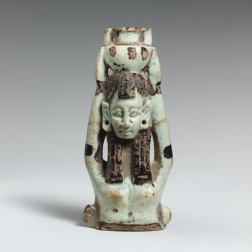 Fragment of a faience statuette of a woman holding a vase on her head