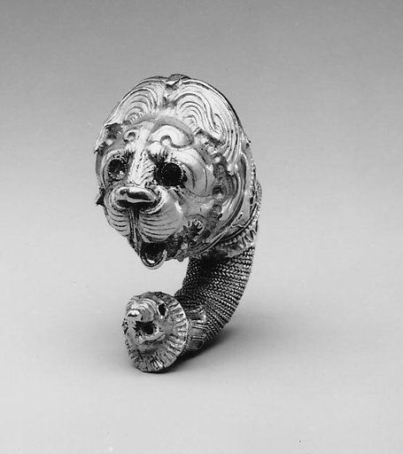 Gold double lion's head earring