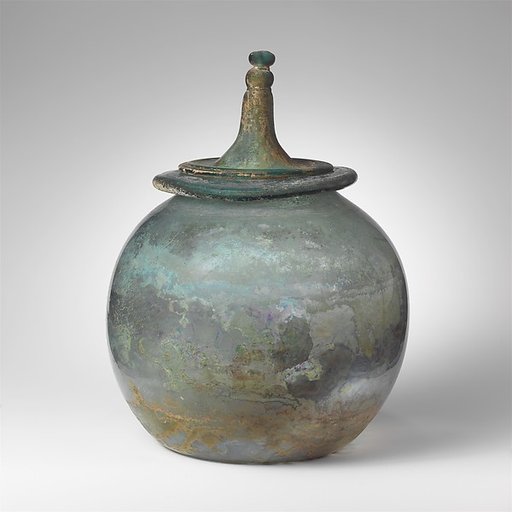 Glass cinerary urn with lid