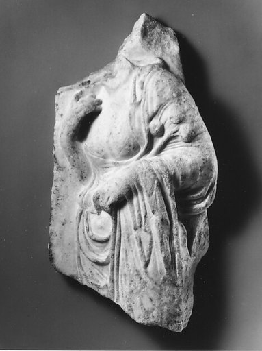 Marble relief fragment with the torso of a Hesperid holding apples