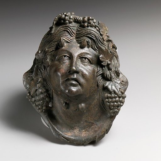 Bronze attachment in the form of the head of Pan