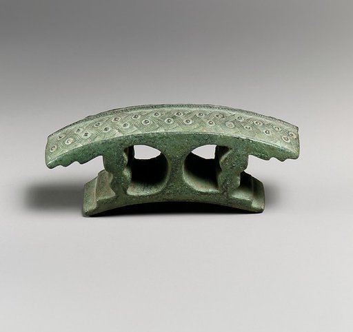 Bronze attachment with silver studs