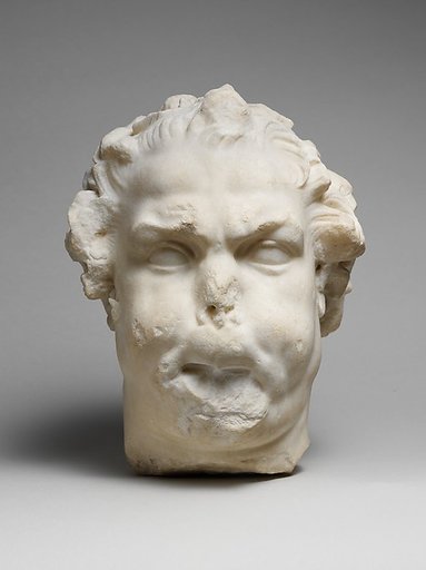 Marble head of a satyr playing the double flute