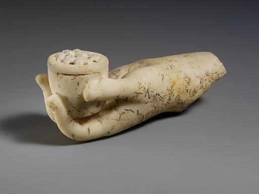 Marble left hand holding a small box