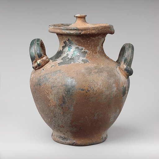 Glass cinerary urn with lid