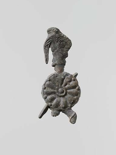 Lead figure of a warrior with a helmet, shield, and spear