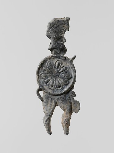 Lead figure of a warrior with a helmet, shield, and spear
