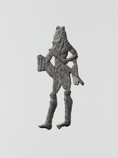 Lead figure of a man with a spear or scepter