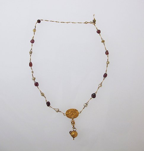 Necklace with pendant and glass beads