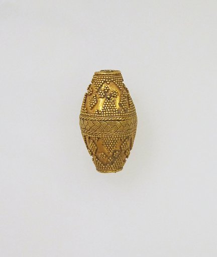 Bead ornamented with coarse granules
