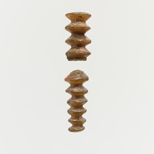 Serpentine (?) pendant fragments with transverse grooves