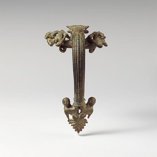 Bronze oinochoe (jug) handle with satyrs flanking a head of Acheloos
