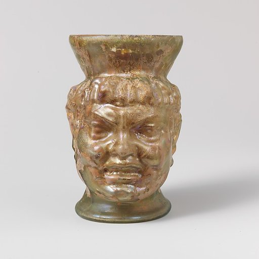 Glass cup in the shape of a Black African's head