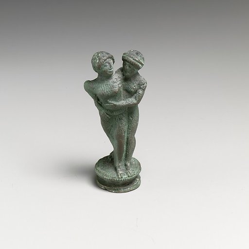 Bronze candelabrum finial showing a man embracing a woman