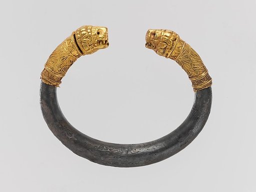 Silver bracelet with gold lion's head finials
