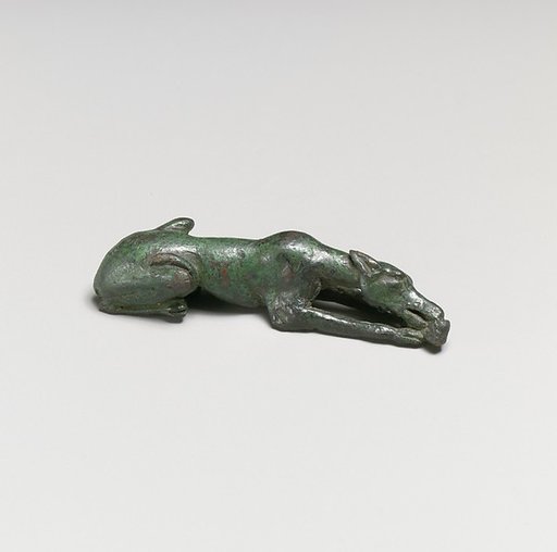 Bronze statuette of a hound gnawing a bone
