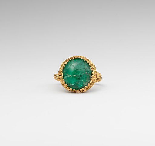 Gold ring set with an emerald
