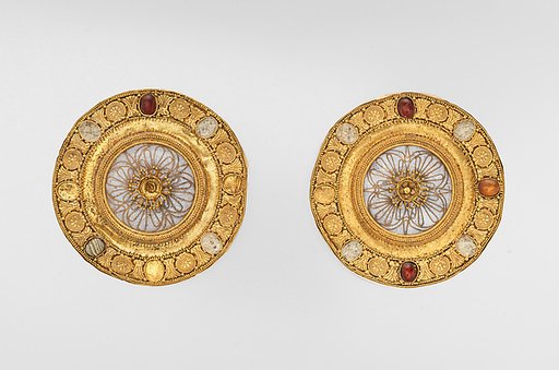 Pair of gold and rock crystal disks, set with garnet and glass inlays