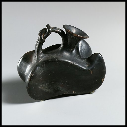 Terracotta askos (flask with a spout and handle over the top)