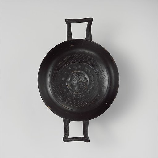 Terracotta stemless kylix (drinking cup)