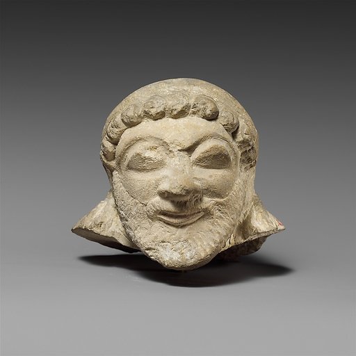 Limestone head of a silen (?)