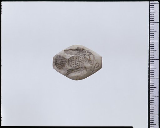 White stone engraved gem