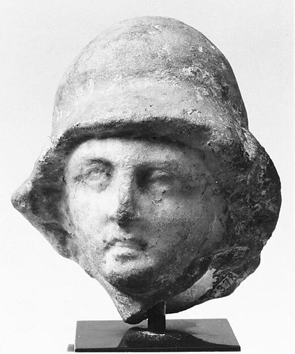 Small helmeted head from a marble relief