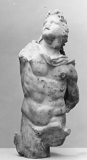 Marble statuette of a male figure with shaggy hair
