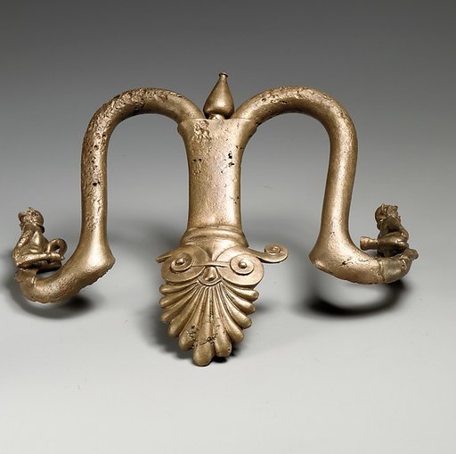 Handles and feet of a bronze louterion (basin)