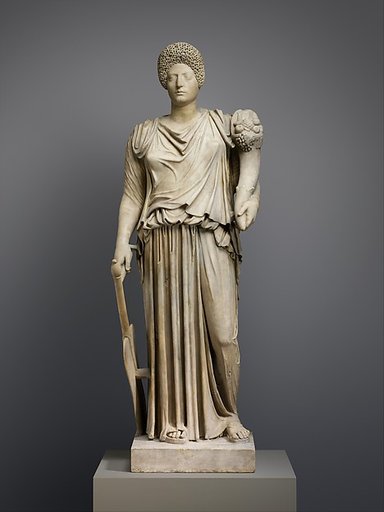 Marble statue of Tyche-Fortuna restored with the portrait head of a woman