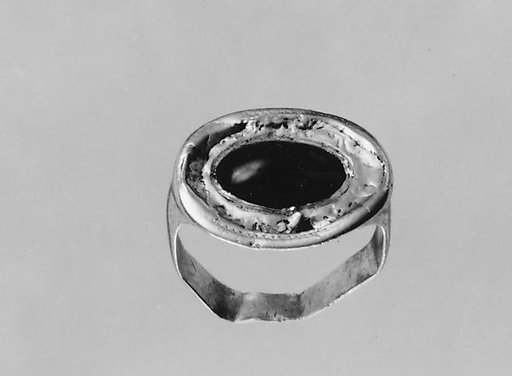 Gold ring with a garnet